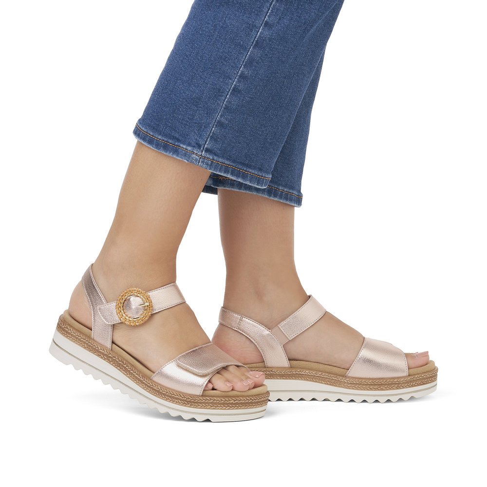 Pink remonte women´s strap sandals D0Q52-31 with a hook and loop fastener. Shoe on foot.