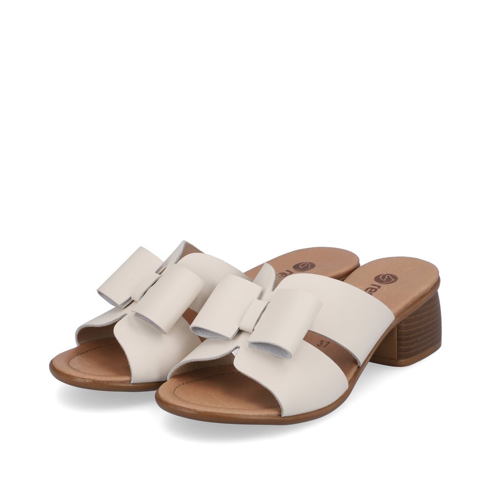 Beige remonte women´s mules R8759-60 with feminine bow. Shoes laterally.