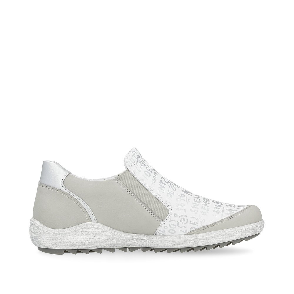White remonte women´s slippers R1428-80 with a zipper and text pattern in silver. Shoe inside.