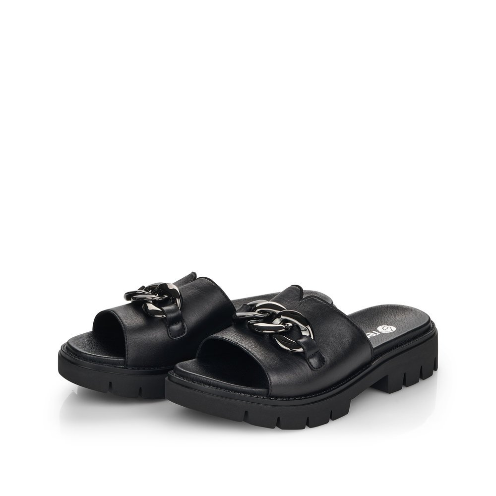 Black remonte women´s mules D7952-00 with chain element and a soft leather footbed. Shoes laterally.