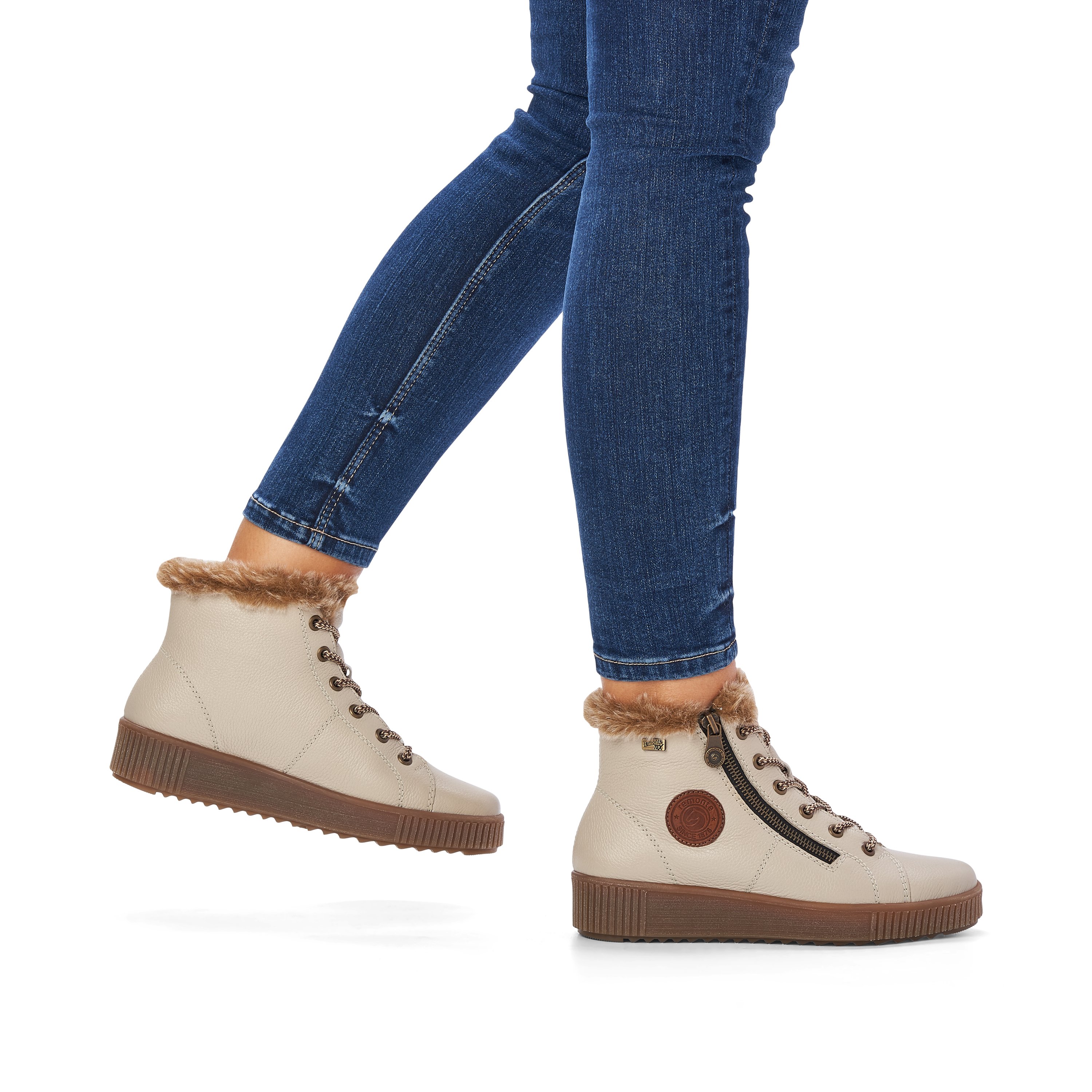 Cinnamon white remonte women´s lace-up boots R7980-80 with lacing and zipper. Shoe on foot