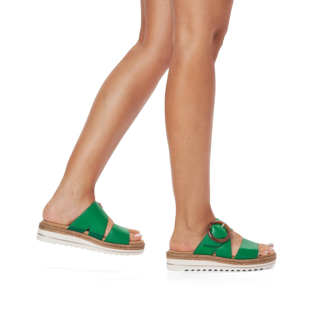 Emerald green remonte women´s mules D0Q51-52 with a hook and loop fastener. Shoe on foot.