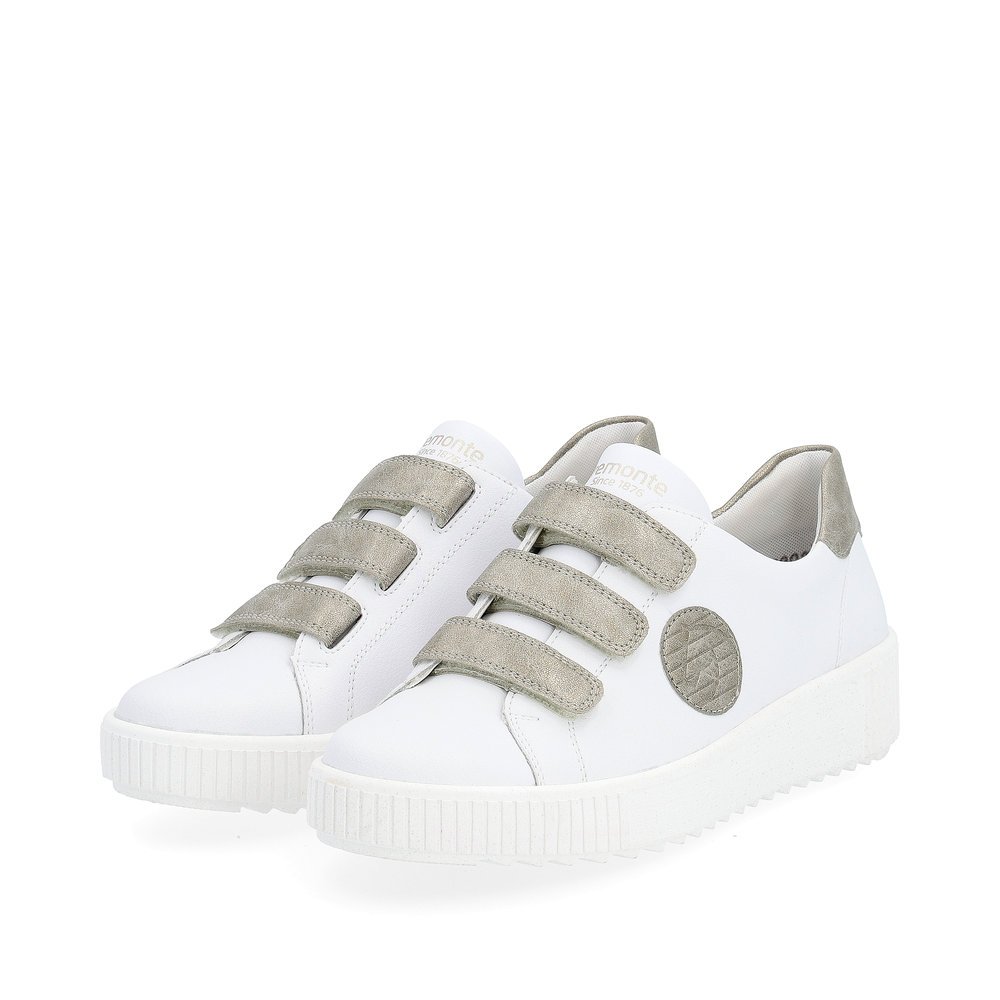 White remonte women´s sneakers R7902-80 with a hook and loop fastener and grey logo. Shoes laterally.