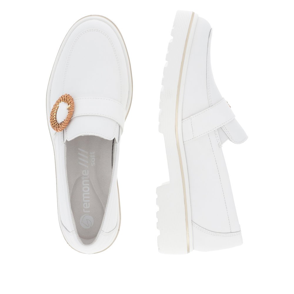White remonte women´s loafers D1H00-80 with elastic insert and fashionable brooch. Shoe from the top, lying.