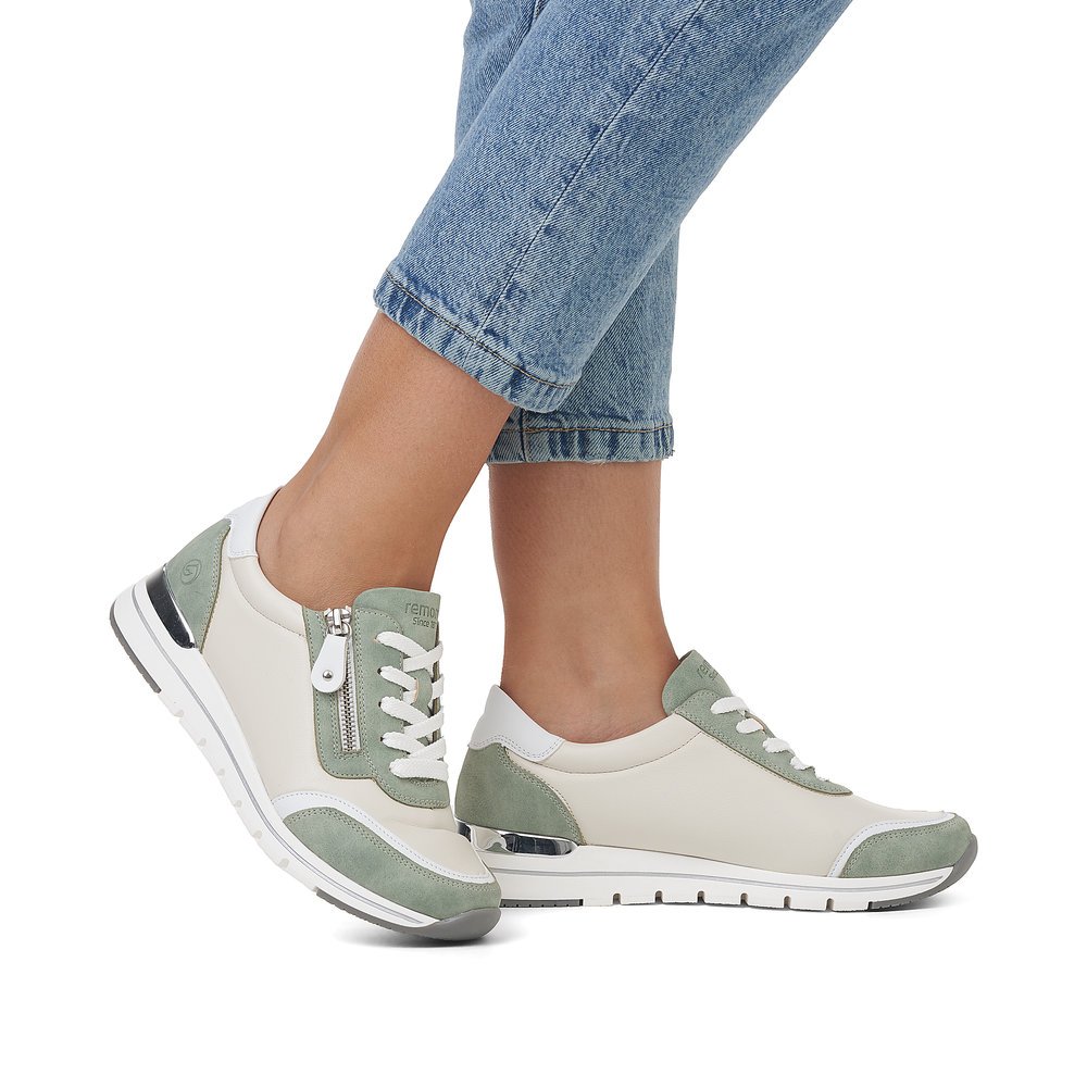 Beige vegan remonte women´s sneakers R6709-81 with a zipper and comfort width G. Shoe on foot.