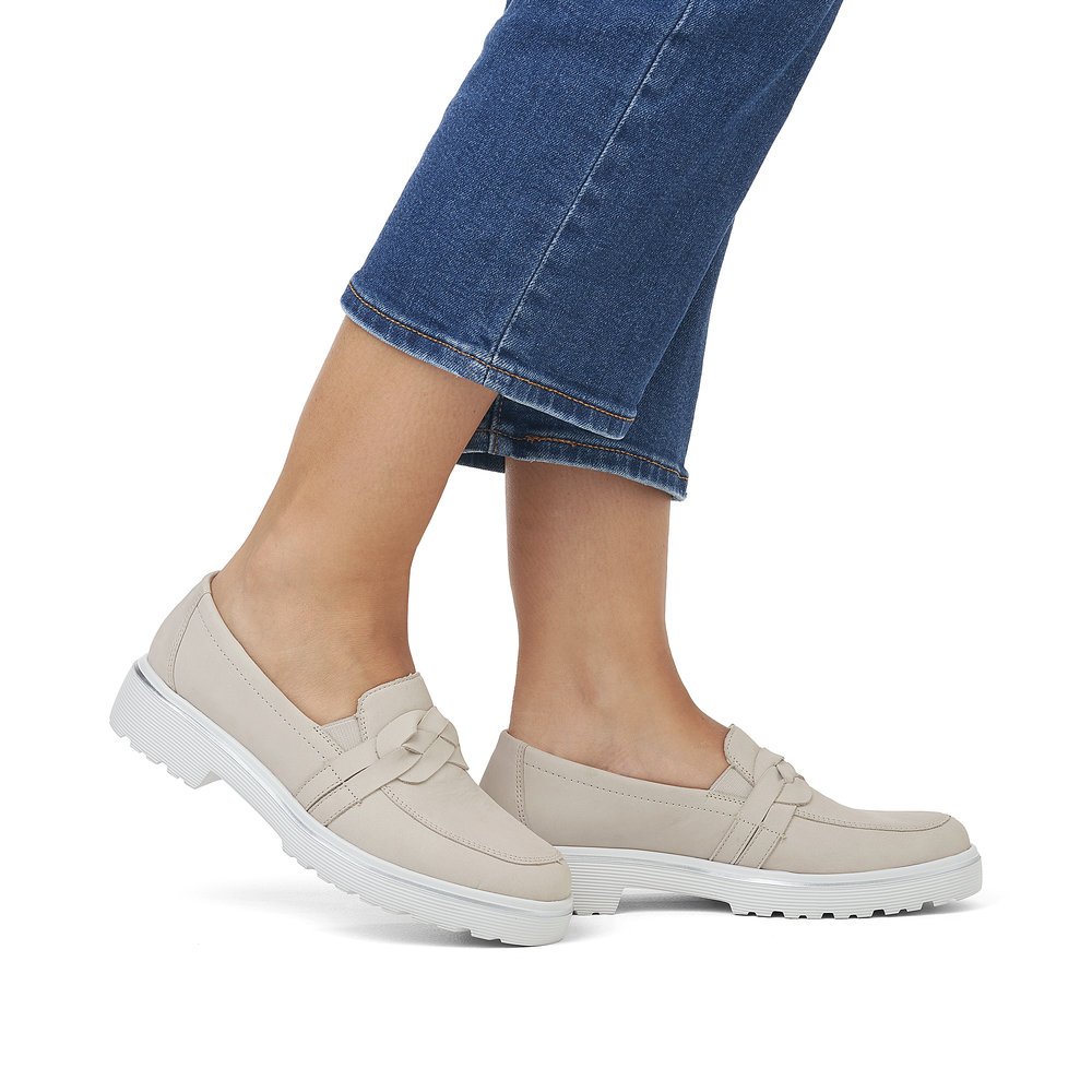 Beige grey remonte women´s loafers D1H01-40 with elastic insert and braided strap. Shoe on foot.