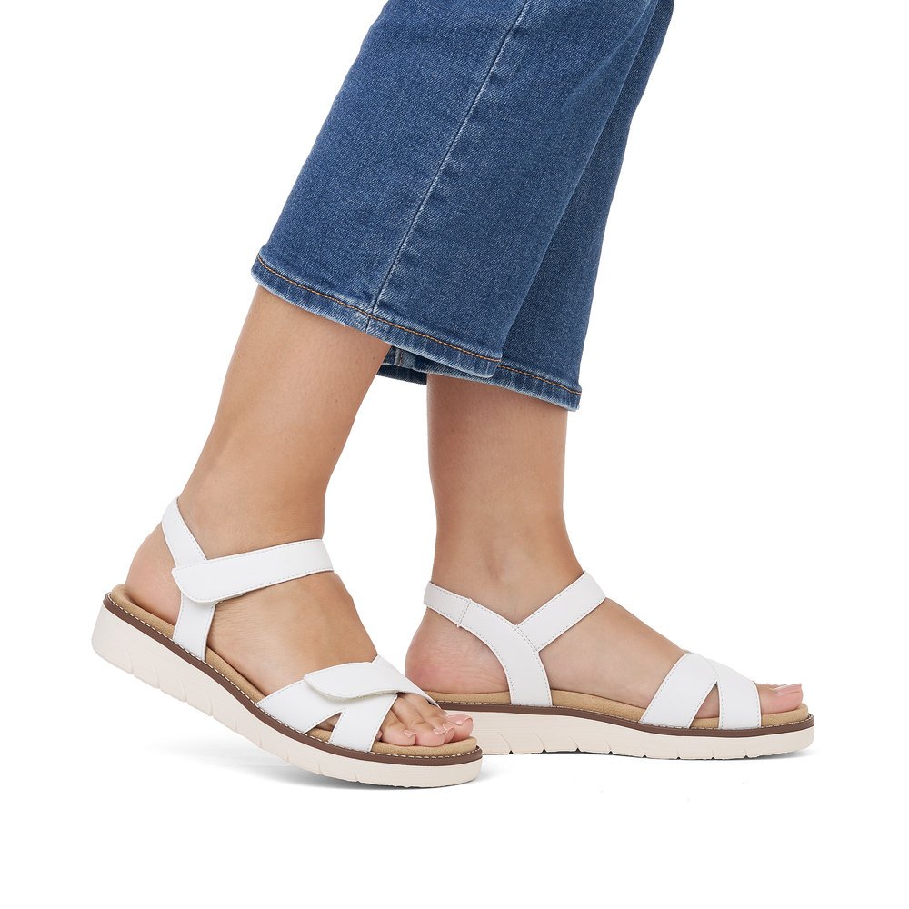 Sparkling white remonte women´s strap sandals D2049-83 with hook and loop fastener. Shoe on foot.