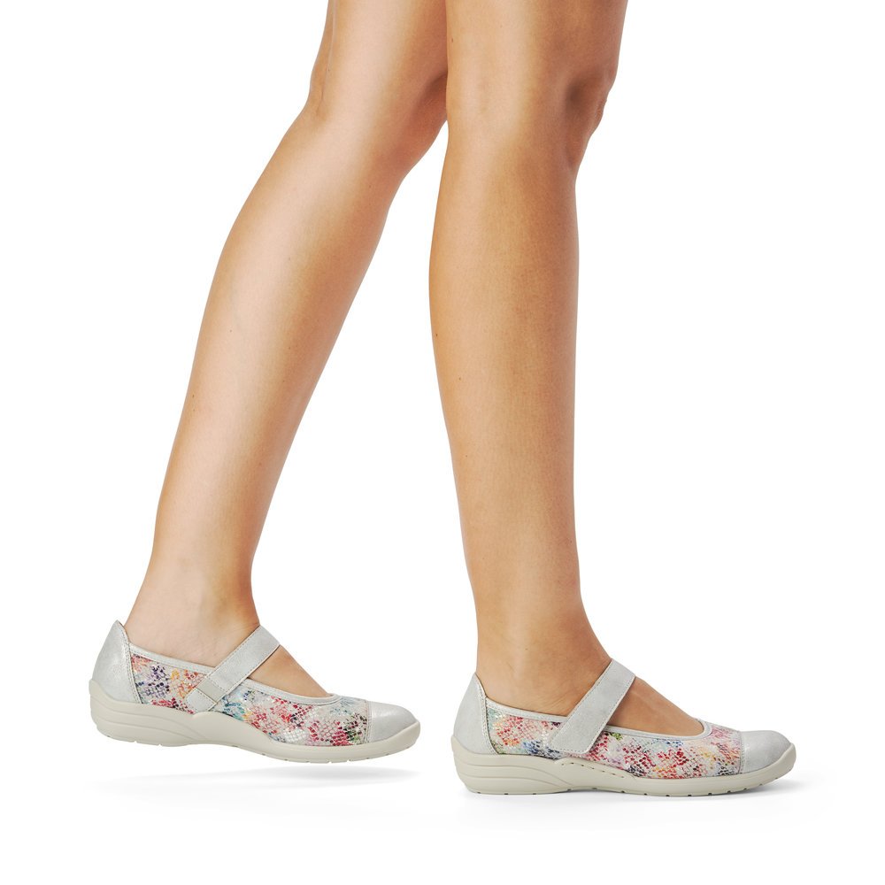 Colorful remonte women´s ballerinas R7627-40 with a hook and loop fastener. Shoe on foot.