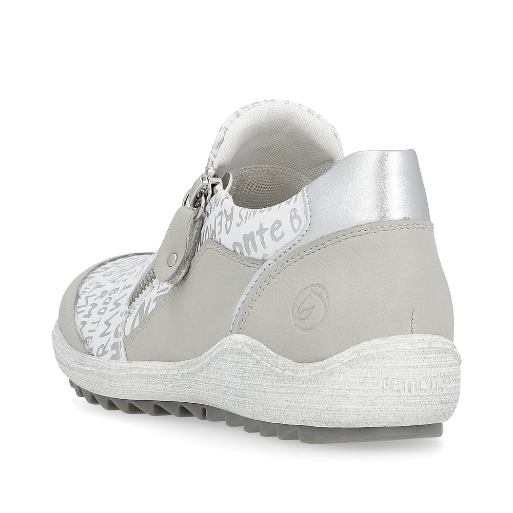 White remonte women´s slippers R1428-80 with a zipper and text pattern in silver. Shoe from the back.