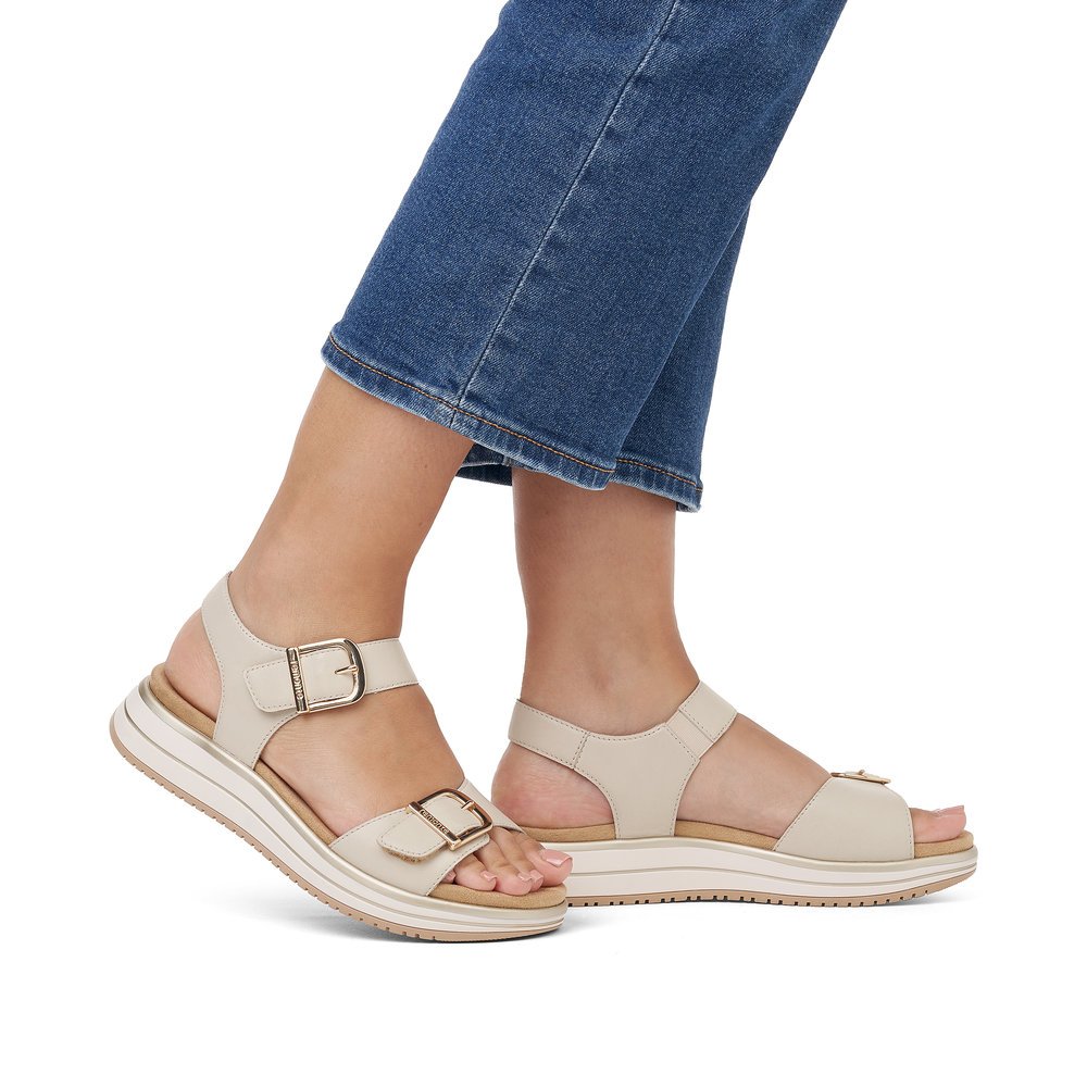 Light beige remonte women´s strap sandals D1J51-80 with hook and loop fastener. Shoe on foot.