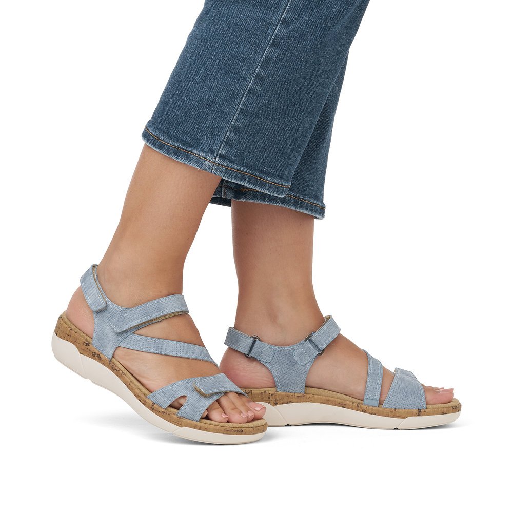 Ice blue remonte women´s strap sandals R6850-15 with hook and loop fastener. Shoe on foot.