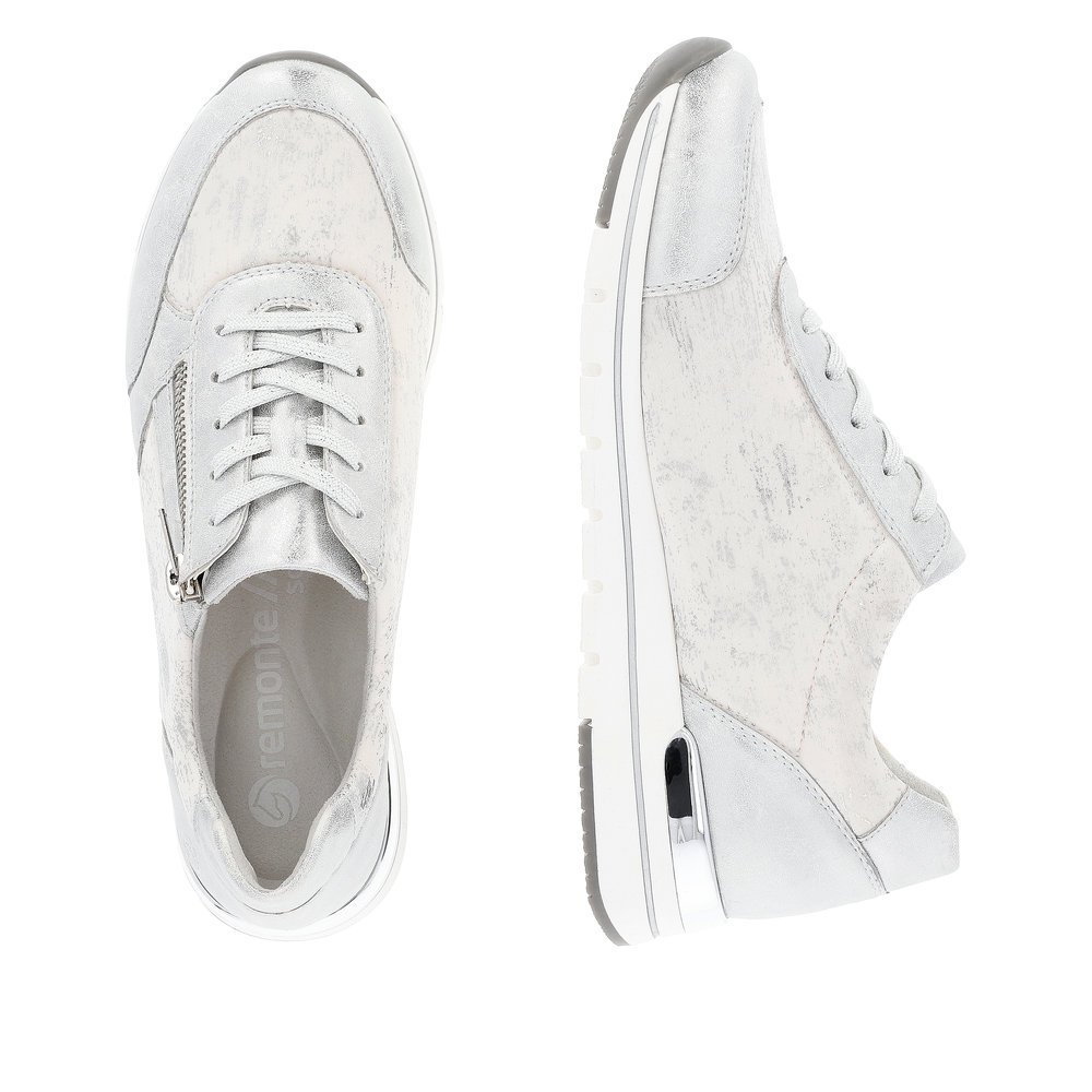 Silver remonte women´s sneakers R6700-91 with a zipper and washed-out pattern. Shoe from the top, lying.