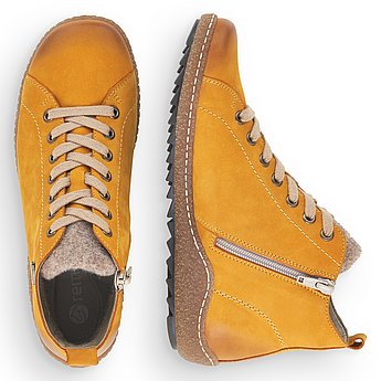 Gelbe Stiefeletten aus Rauhleder mit Reißverschluss und Schnürung, wasserabweisendem Remonte TEX und Wechselfußbett. Schuhe Innenseite.
