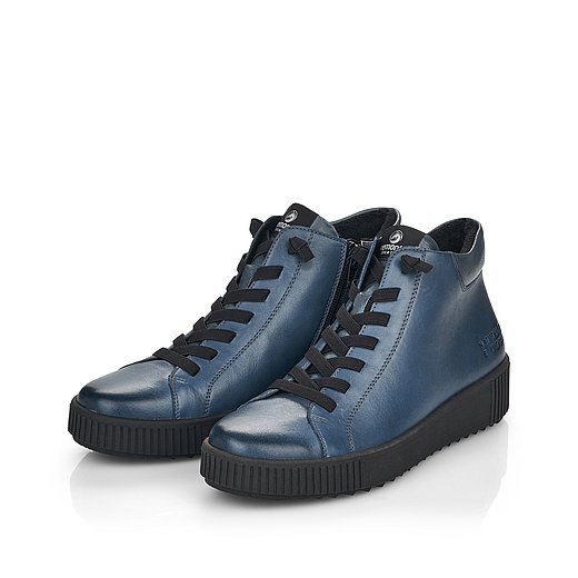 Blaue Stiefeletten leicht wärmend aus Glattleder mit Reißverschluss und Gummizug und Wechselfußbett. Schuhe seitlich schräg. 