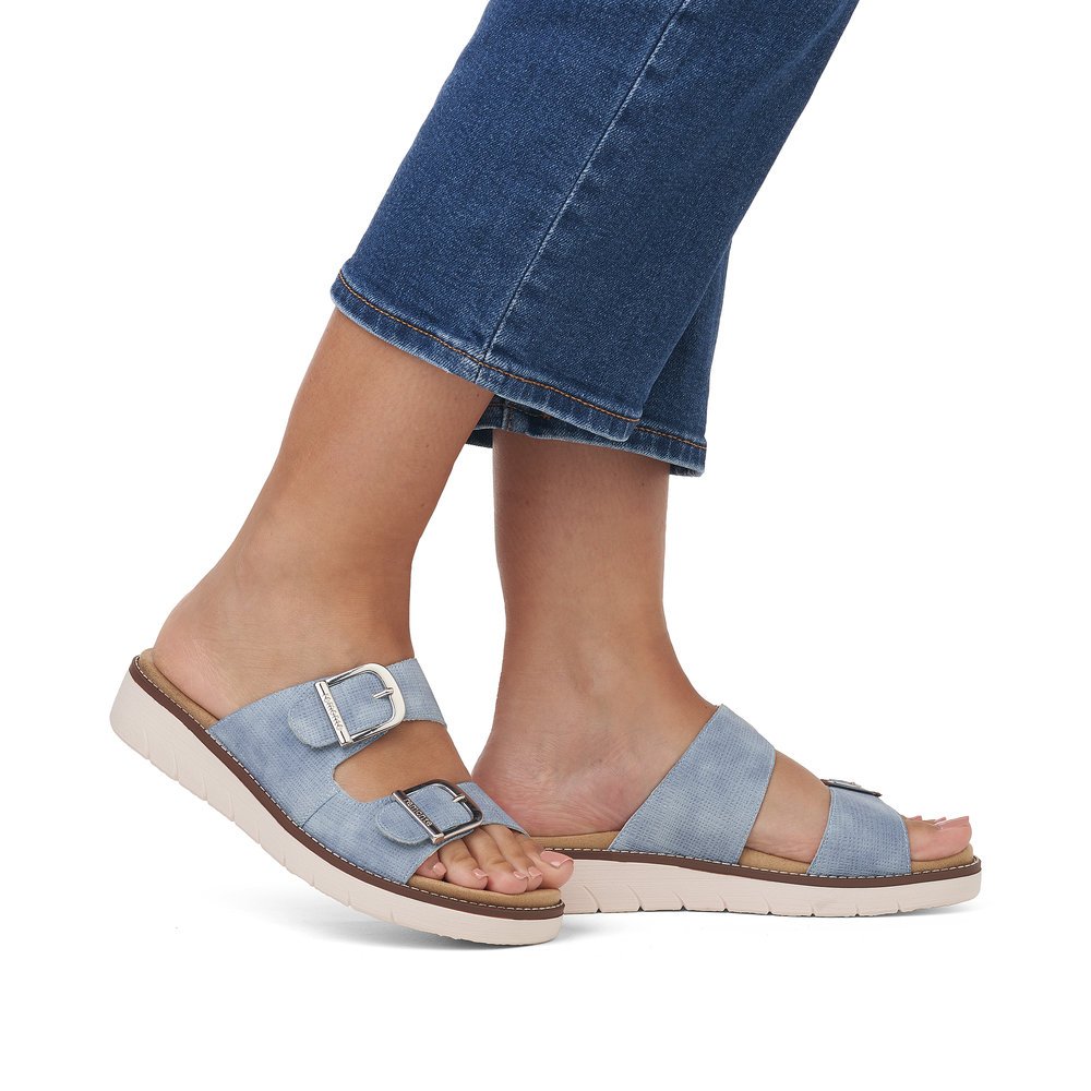 Sea blue remonte women´s mules D2070-14 with a hook and loop fastener. Shoe on foot.