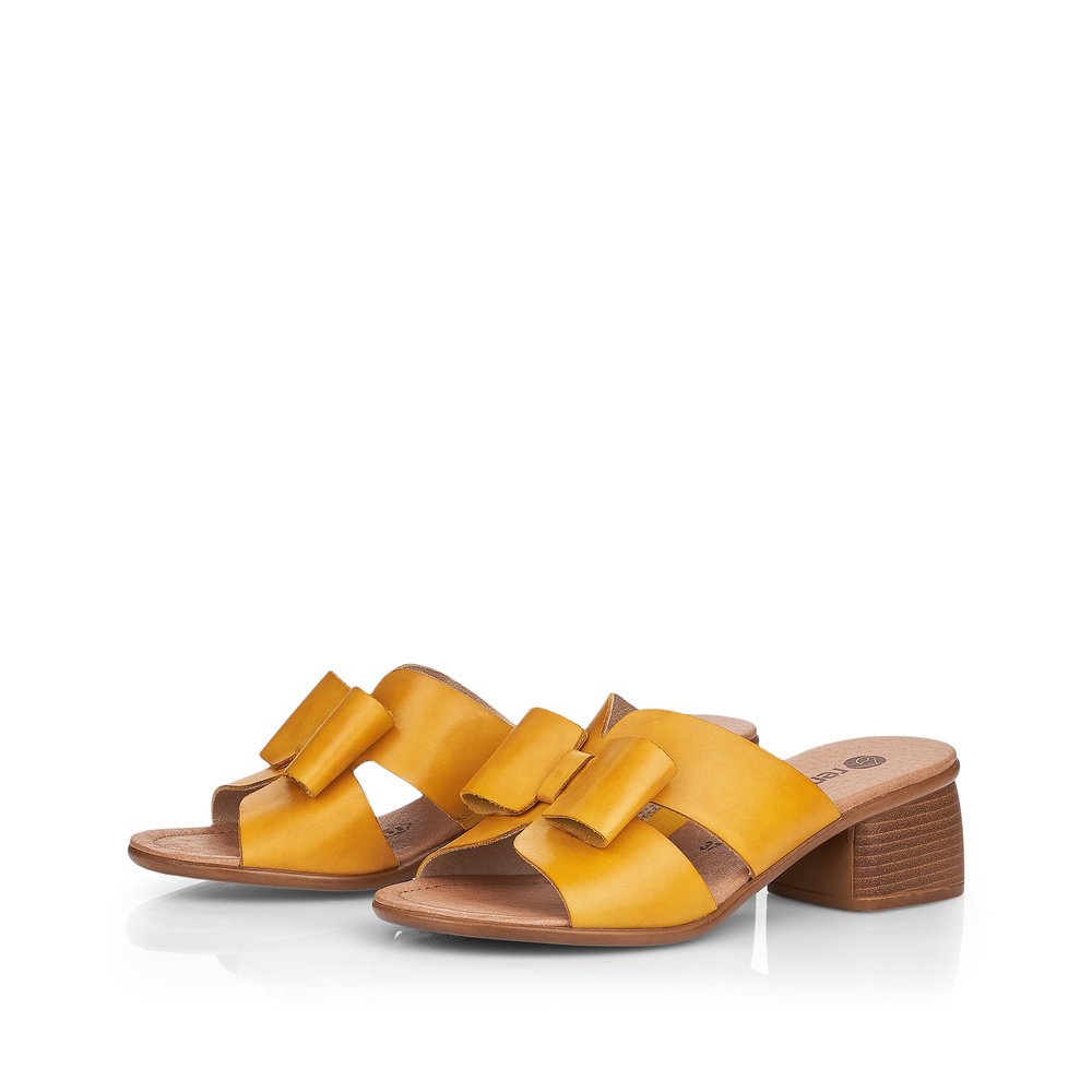 Yellow remonte women´s mules R8759-68 with feminine bow. Shoes laterally.