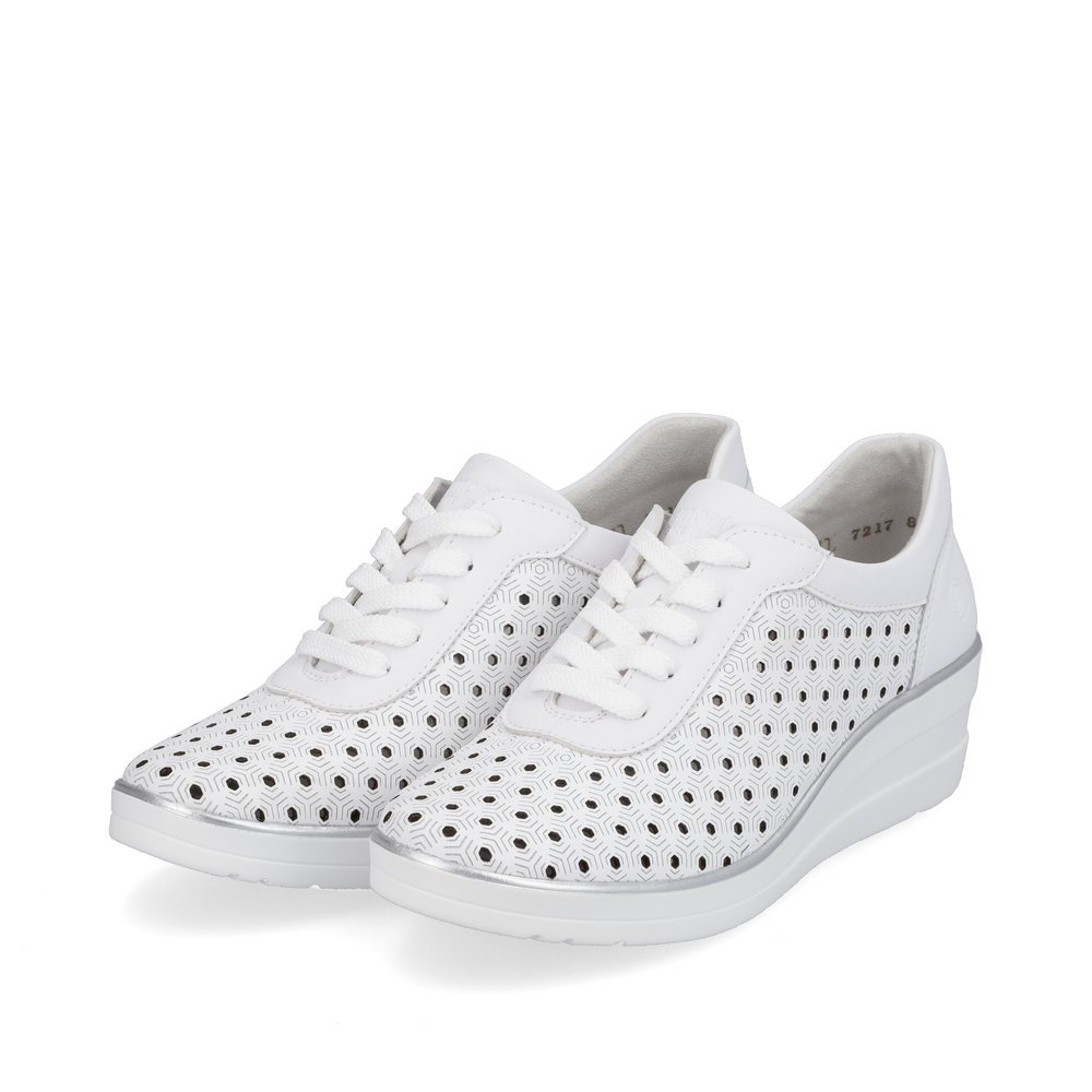 White remonte women´s sneakers R7217-80 with a lacing and perforated look. Shoes laterally.