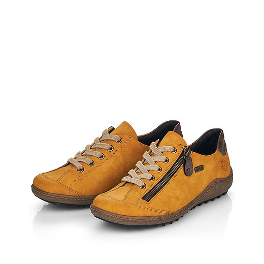 Gelbe Halbschuhe aus Lederimitat mit Reißverschluss und Schnürung, wasserabweisendem Remonte TEX und Wechselfußbett. Schuhe seitlich schräg. 