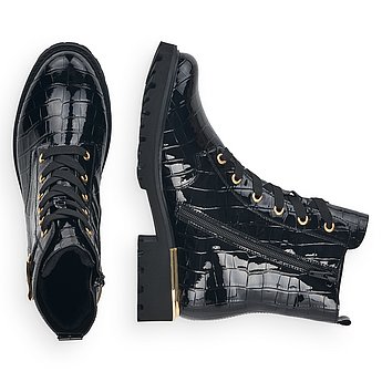 Schwarze Stiefeletten leicht wärmend aus Kunstlack mit Reißverschluss und Schnürung und Wechselfußbett. Schuhe Innenseite.