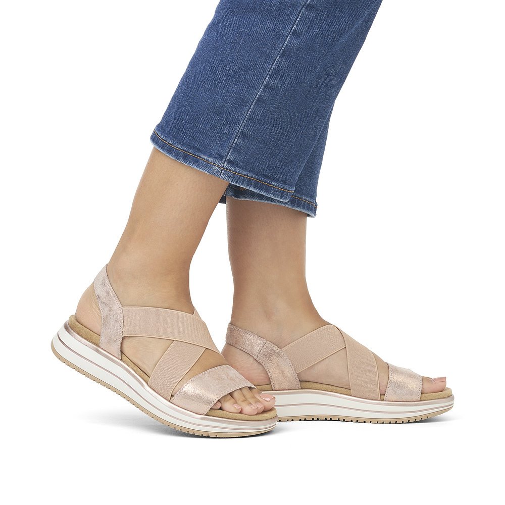 Pink remonte women´s strap sandals D1J50-31 with an elastic insert. Shoe on foot.