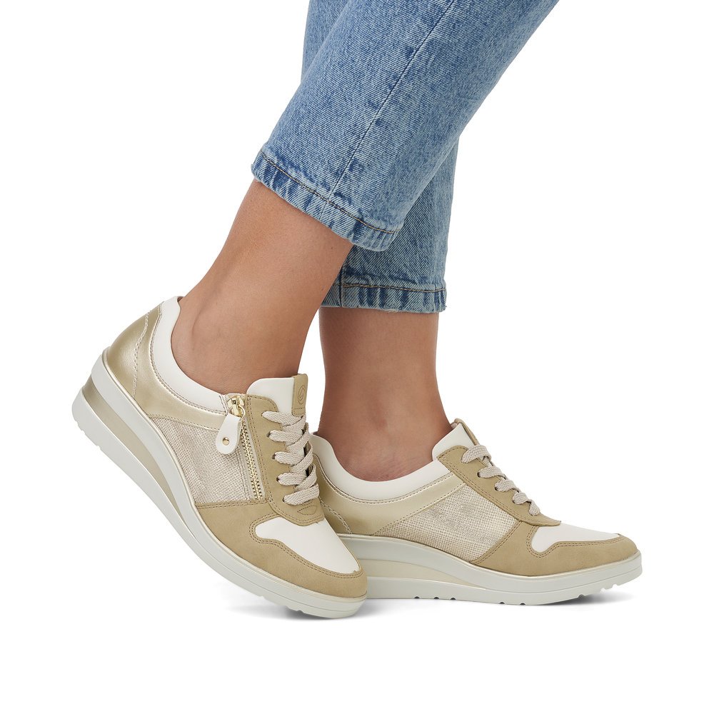 Beige remonte women´s sneakers R7213-62 with zipper and extra width H. Shoe on foot.