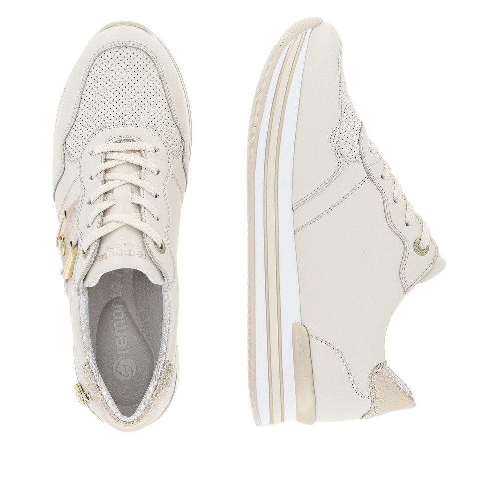 Off-white remonte women´s sneakers D1322-60 with lacing and metal element. Shoe from the top, lying.
