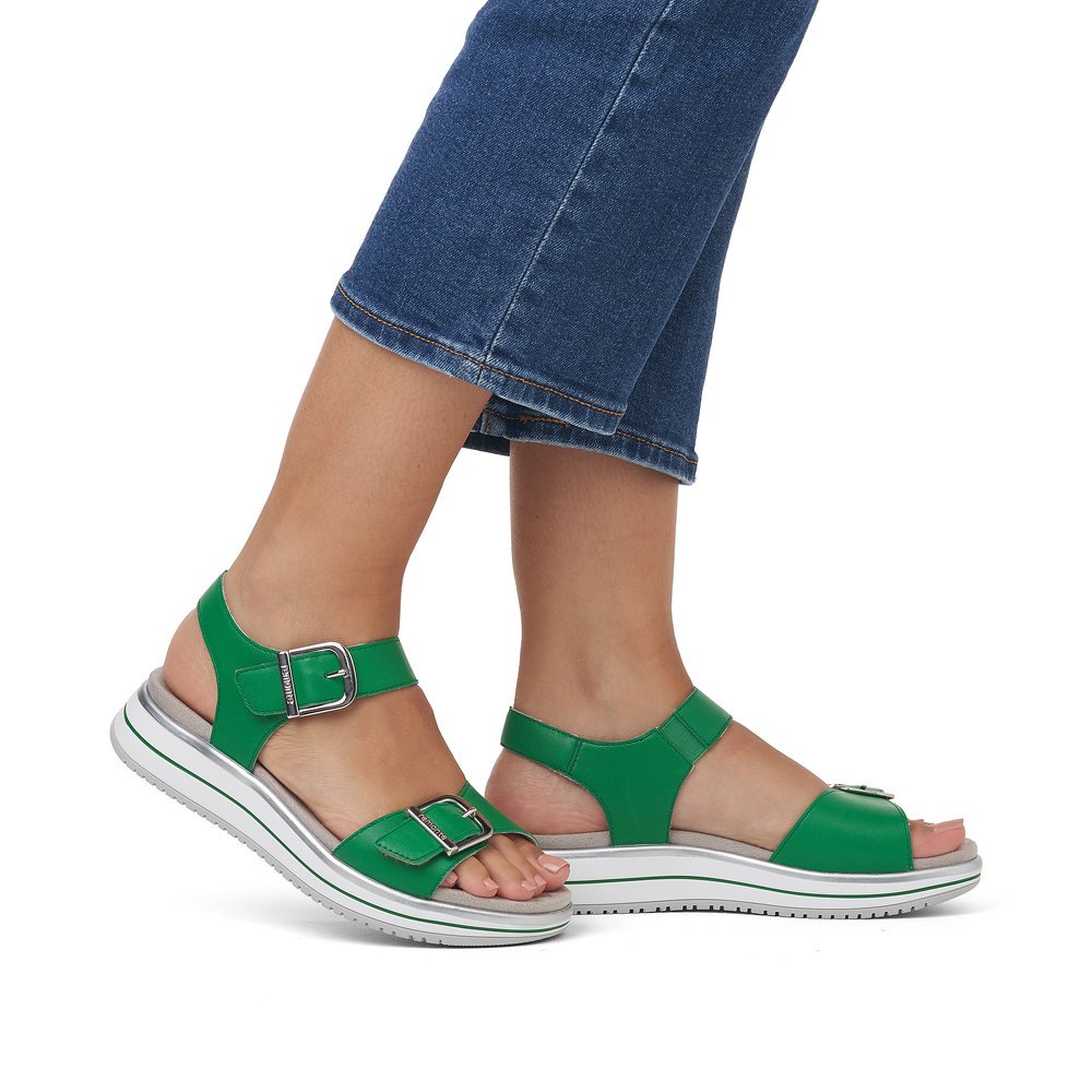 Green remonte women´s strap sandals D1J51-52 with hook and loop fastener. Shoe on foot.