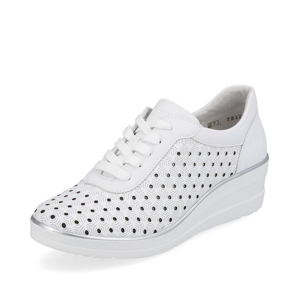 White remonte women´s sneakers R7217-80 with a lacing and perforated look. Shoe laterally.
