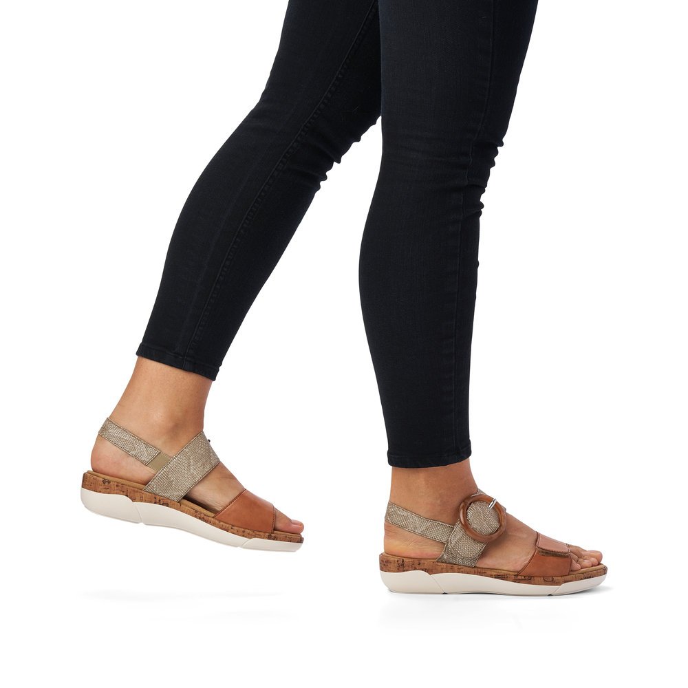 Brown remonte women´s strap sandals R6853-90 with hook and loop fastener. Shoe on foot.