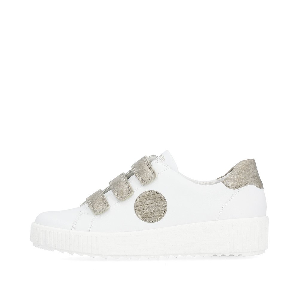 White remonte women´s sneakers R7902-80 with a hook and loop fastener and grey logo. Outside of the shoe.