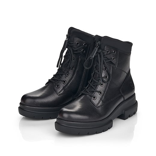Schwarze Stiefeletten leicht wärmend aus Glattleder mit Reißverschluss und Schnürung und Wechselfußbett. Schuhe seitlich schräg. 