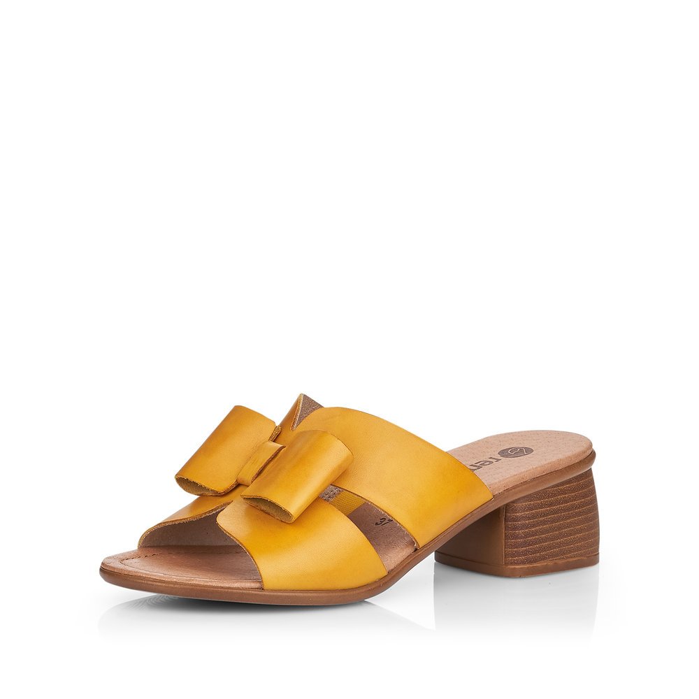 Yellow remonte women´s mules R8759-68 with feminine bow. Shoe laterally.