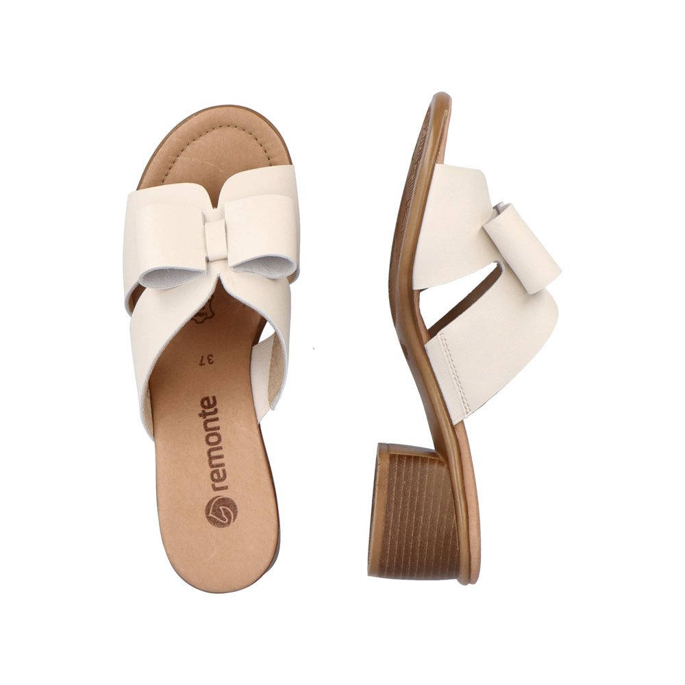 Beige remonte women´s mules R8759-60 with feminine bow. Shoe from the top, lying.