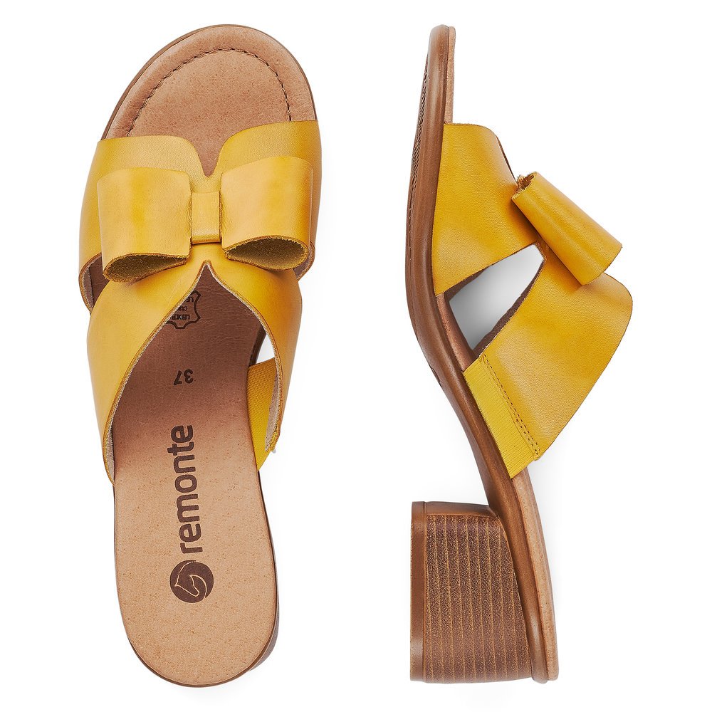Yellow remonte women´s mules R8759-68 with feminine bow. Shoe from the top, lying.